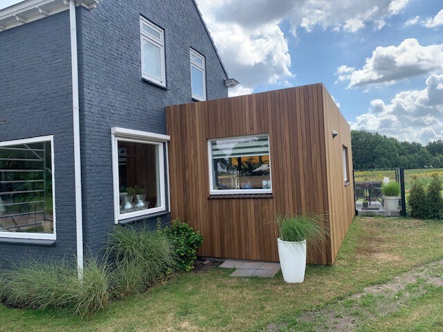 Aanbouw bekleding met Ayous